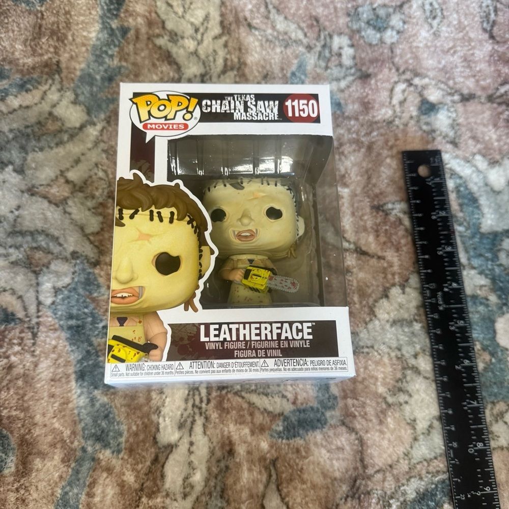 Funko Pop Movies Leatherface Figure with Brown and Yellow Accents